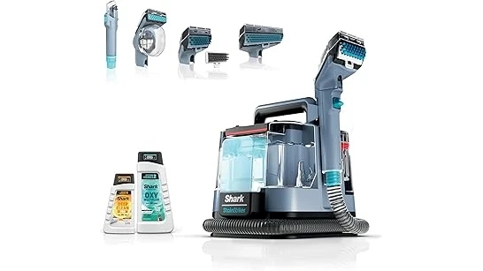 The image shows a mattress steam cleaner in action, cleaning a white mattress.