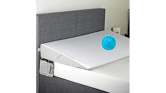 The image shows a comfortable bed wedge placed under a mattress for elevated support.