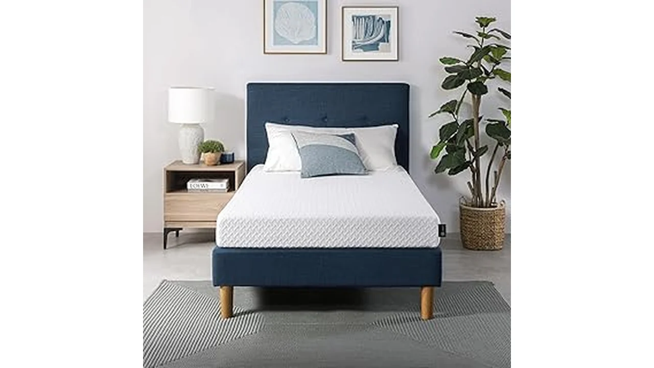 The image shows a neatly made bed with several mattresses displayed around it.
